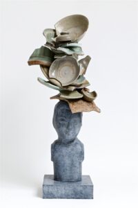 Bronze head with celadon shards 2